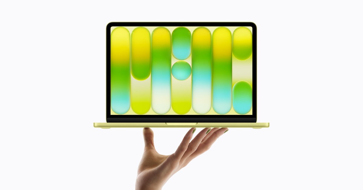 Citrus MacBook Neo held open with its screen facing forward